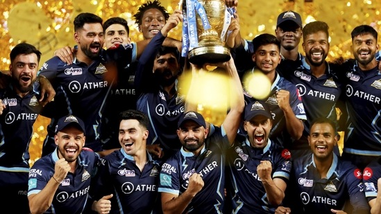Gujarat Titans players with the IPL trophy after winning the final T20 cricket match of the Indian Premier League 2022 (PTI)