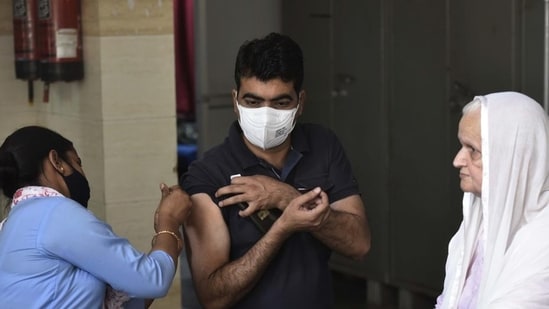 A health worker administers a booster dose of a Covid-19 vaccine to a beneficiary, in Gurugram. (File image)