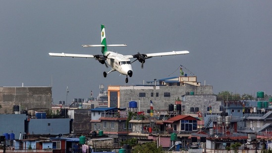 Tara Air's DHC-6 Twin Otter, tail number 9N-AET prepares to land at the airport of Pokhara, Nepal. Picture taken April 11, 2022. (REUTERS/Nicolas Economou)