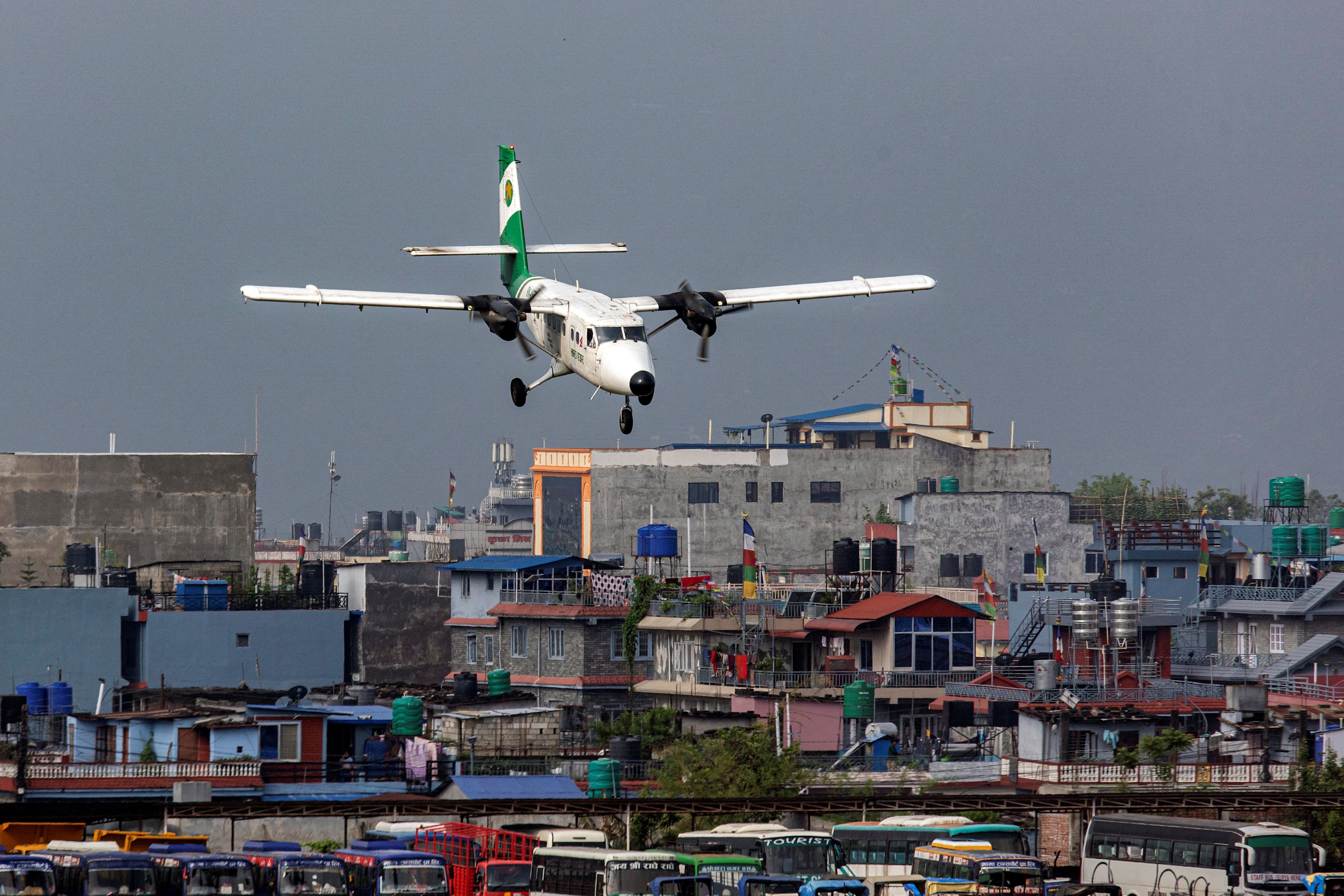 Tara Air's DHC-6 Twin Otter, tail number 9N-AET prepares to land at the airport of Pokhara, Nepal. Picture taken April 11, 2022. (REUTERS/Nicolas Economou)