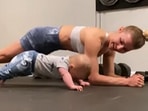 The cute baby works out with his mum in this Instagram video that has gone viral. 