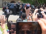 President Joe Biden hangs out of his car as he acknowledges a crowd after attending mass at Sacred Heart Catholic Church on May 29, 2022 in Uvalde, Texas.&nbsp;