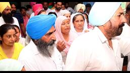 Charan Kaur, the mother of Sidhu Moose Wala, and other family members at the Mansa Civil Hospital, where the singer was declared dead on Sunday evening.  (Sanjeev Kumar / HT)