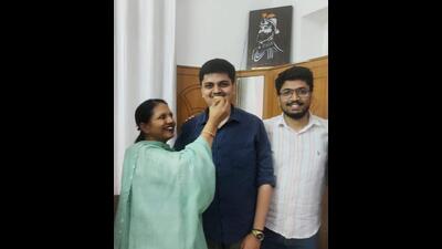 Umesh Goyal (centre) celebrating with family in Ludhiana on Monday. (HT Photo) Umesh Goyal (centre) celebrating with family in Ludhiana on Monday. (HT Photo)