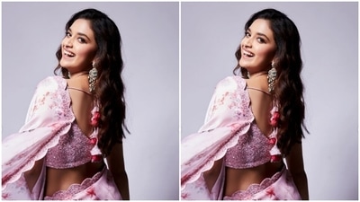 Keerthy minimally accessorised her look for the day with statement silver jhumkas embedded with pastel blue stones from the shelves of Kalasha Fine Jewellery. (Instagram/@keerthysureshofficial)