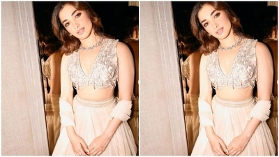 Tamannaah teamed a white sleeveless blouse with silver resham thread embroidery with a long flowy skirt decorated in silver threads. She added a white dupatta and completed her look. (Instagram/@tamannaahspeaks)