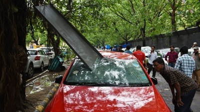 Several images showed damage to cars. In the above picture, a sharp object has fallen on a park car at KG Marg service lane due to a dust storm accompanied by rainfall, in New Delhi. People also shared reports about the strong winds snapping power and internet cables, throwing parts of the capital into chaos. Several images showed damage to cars. In the above picture, a sharp object has fallen on a park car at KG Marg service lane due to a dust storm accompanied by rainfall, in New Delhi. People also shared reports about the strong winds snapping power and internet cables, throwing parts of the capital into chaos.