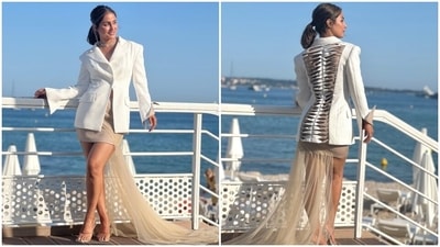 Earlier, Hina Khan had dropped pictures of her D-day in Cannes when she launched the poster of her new film at the India Pavilion. The star slipped into a chic long white blazer with back cut-out details and a nude skirt with a tulle train attached on the back. She completed the look with minimal accessories and nude-palette makeup. (Instagram) Earlier, Hina Khan had dropped pictures of her D-day in Cannes when she launched the poster of her new film at the India Pavilion. The star slipped into a chic long white blazer with back cut-out details and a nude skirt with a tulle train attached on the back. She completed the look with minimal accessories and nude-palette makeup. (Instagram)