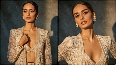 Manushi wore a sharara and bralette set paired with a long sheer-panelled cape jacket. While the sleeveless bralette had a plunging V neckline and hem, sequinned embellishments and intricate threadwork, the sharara pants featured similar geometric patterned embroidery and intricately-placed sequins. (Instagram) Manushi wore a sharara and bralette set paired with a long sheer-panelled cape jacket. While the sleeveless bralette had a plunging V neckline and hem, sequinned embellishments and intricate threadwork, the sharara pants featured similar geometric patterned embroidery and intricately-placed sequins. (Instagram)