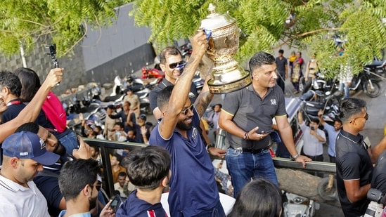 Gujarat Titans skipper Hardik Pandya holds IPL Trophy while taking part in a victory parade&nbsp;(ANI/Nandan Dave)