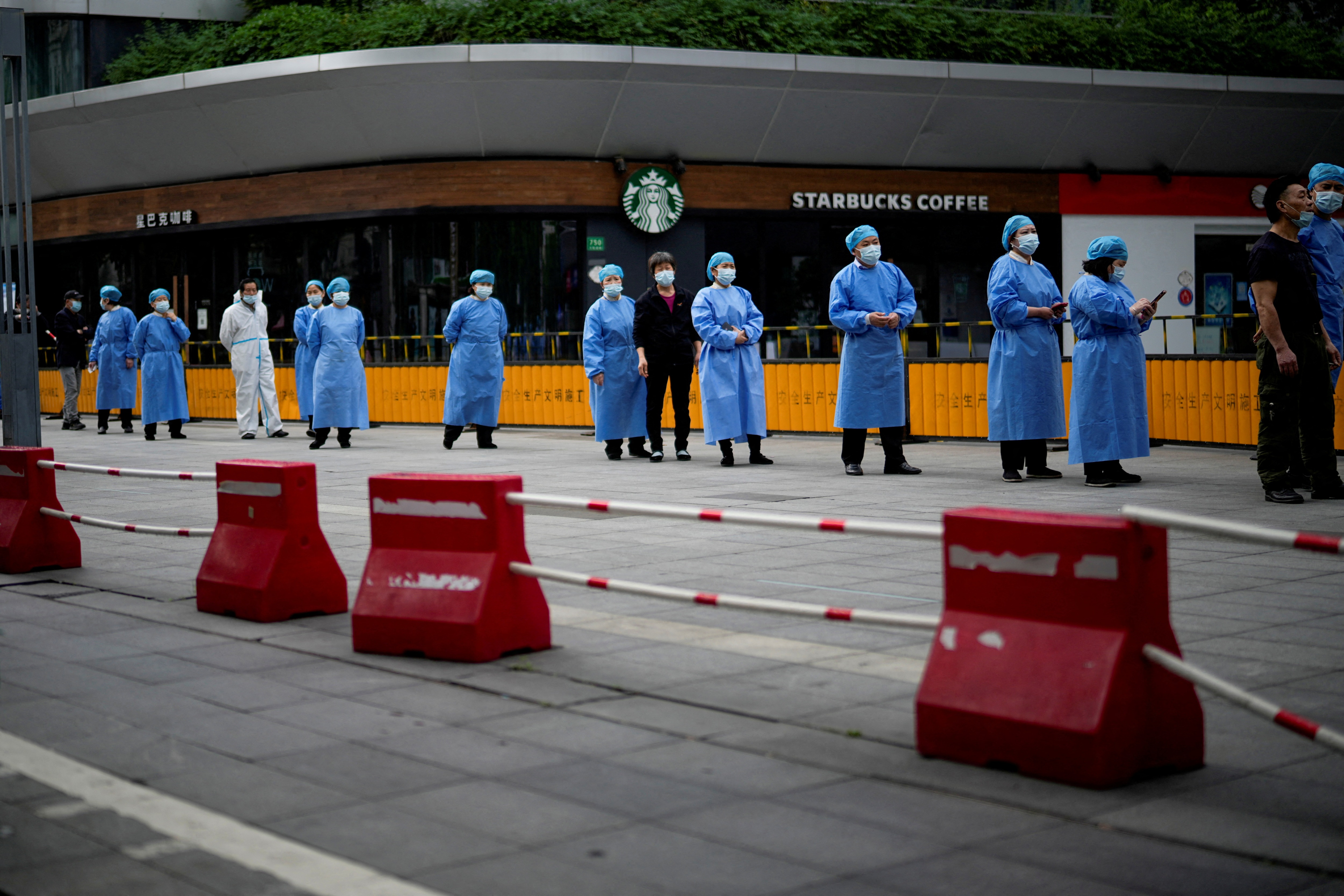 FILE PHOTO: People line up for nucleic acid tests during lockdown, amid the coronavirus disease (COVID-19) pandemic, in Shanghai, China. (REUTERS)