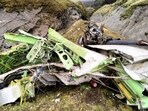 This handout photograph taken on May 30, 2022 and released by the Nepal Police shows the wreckage of a Twin Otter aircraft, operated by Nepali carrier Tara Air, laying on a mountainside in Mustang, a day after it crashed. (Photo by Man Bahadur Basyal / Nepal Police / AFP) 