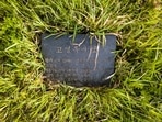 This aerial photo shows a tombstone of North Korean leader Kim Jong Un's maternal great grandfather that translates as 'Ko Yong-ok. Born in 1876 and laid to rest in 1945 in Jeju', near other tombstones also bearing the Ko family name.