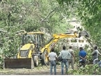 Workers clear the HC Mathur lane near Connaught Place on Tuesday. Workers clear the HC Mathur lane near Connaught Place on Tuesday. 