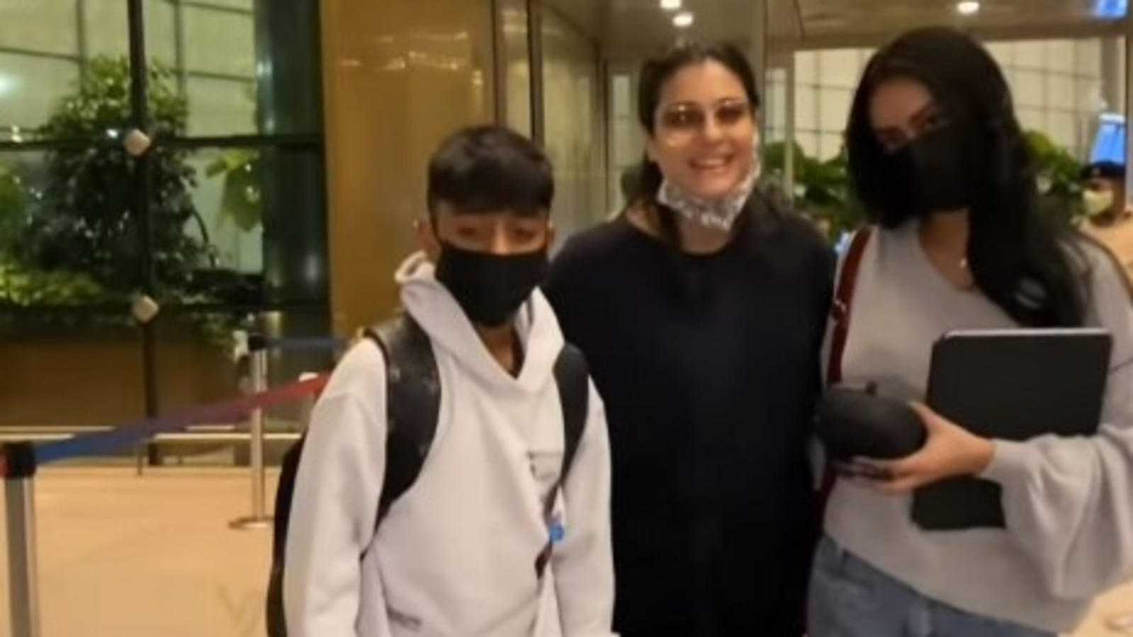 Kajol poses for pics with Nysa and Yug as they leave for vacation