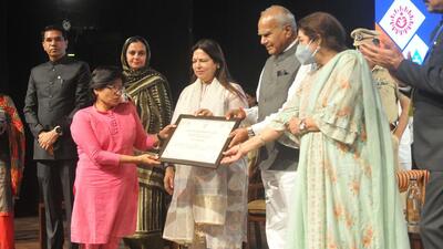 Chandigarh administrator UT Banwari lal Purohit along with Union minister Meenakshi Lekhi, MP Kirron Kher felicitating GOI’s social welfare scheme beneficiaries at Tagore Theatre. (Ravi Kumar/HT)