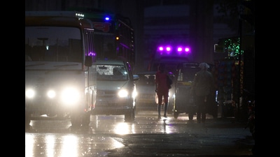 Motorist seen on road during rain at Pune station on Tuesday. (HT PHOTO) Motorist seen on road during rain at Pune station on Tuesday. (HT PHOTO)