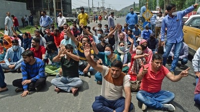 Kashmiri Pandits raise slogans while blocking the road during a protest against the killing of a school teacher, who was shot dead by the militants at the Gopalpora area of Kulgam, in Srinagar. (ANI) Kashmiri Pandits raise slogans while blocking the road during a protest against the killing of a school teacher, who was shot dead by the militants at the Gopalpora area of Kulgam, in Srinagar. (ANI)