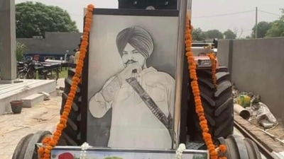 A portrait of late singer Sidhu Moose Wala on his favourite tractor 5911. A portrait of late singer Sidhu Moose Wala on his favourite tractor 5911.