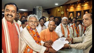BJP candidate Laxmikant Bajpai files his nomination paper for Rajya Sabha elections, at Vidhan Bhawan, in Lucknow on Tuesday. Uttar Pradesh chief minister Yogi Adityanath, deputy chief minister Keshav Prasad Maurya and BJP state chief Swatantra Dev Singh also seen. (ANI Photo) BJP candidate Laxmikant Bajpai files his nomination paper for Rajya Sabha elections, at Vidhan Bhawan, in Lucknow on Tuesday. Uttar Pradesh chief minister Yogi Adityanath, deputy chief minister Keshav Prasad Maurya and BJP state chief Swatantra Dev Singh also seen. (ANI Photo)