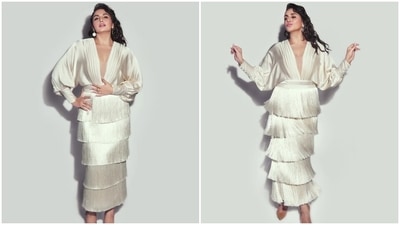 Earlier, Huma had posted pictures of herself dressed in a silk-satin white maxi dress on Instagram with the caption, "White Sorcery." She mixed retro fashion elements with her effortless style to nail the look. The ensemble had a plunging V neckline, billowy long sleeves, tiered tassels on the skirt, and a figure-hugging silhouette. (Instagram) Earlier, Huma had posted pictures of herself dressed in a silk-satin white maxi dress on Instagram with the caption, "White Sorcery." She mixed retro fashion elements with her effortless style to nail the look. The ensemble had a plunging V neckline, billowy long sleeves, tiered tassels on the skirt, and a figure-hugging silhouette. (Instagram)