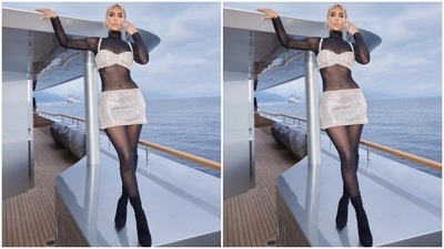 Kim slipped into a sheer full-bodysuit and teamed it with a crystal-embellished skirt and bralette set for the yacht photoshoot. The Keeping Up with the Kardashians alum styled the ensemble with minimal accessories and bold makeup picks, serving a jaw-dropping look. (Instagram) Kim slipped into a sheer full-bodysuit and teamed it with a crystal-embellished skirt and bralette set for the yacht photoshoot. The Keeping Up with the Kardashians alum styled the ensemble with minimal accessories and bold makeup picks, serving a jaw-dropping look. (Instagram)