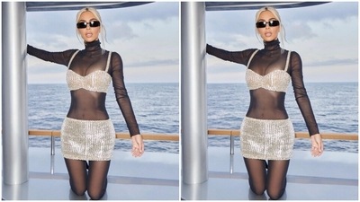 While the bralette features broad straps, a plunging sweetheart neckline flaunting Kim's décolletage and a midriff-baring hem length, the skirt features a low-rise waist, figure-hugging silhouette and cropped mini length. A pair of black pointed boots with killer high heels rounded off Kim's attire. (Instagram) While the bralette features broad straps, a plunging sweetheart neckline flaunting Kim's décolletage and a midriff-baring hem length, the skirt features a low-rise waist, figure-hugging silhouette and cropped mini length. A pair of black pointed boots with killer high heels rounded off Kim's attire. (Instagram)