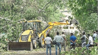 Workers clear the HC Mathur lane near Connaught Place on Tuesday. (ARVIND YADAV/HT) Workers clear the HC Mathur lane near Connaught Place on Tuesday. (ARVIND YADAV/HT)