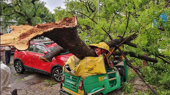 Damaged vehicles after thunderstorm in New Delhi on Monday. (PTI)