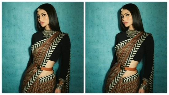 Styled by fashion stylist Maneka Hari Singhani, Mouni wore her tresses open in straight locks with a middle part.(Instagram/@imouniroy)