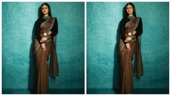 Assisted by makeup artist Mukesh Patil, Mouni decked up in nude eyeshadow, black eyeliner, black kohl, mascara-laden eyelashes, drawn eyebrows, contoured cheeks and a shade of soft pink lipstick.(Instagram/@imouniroy)