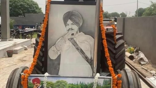 A portrait of late singer Sidhu Moose Wala on his favourite tractor 5911. A portrait of late singer Sidhu Moose Wala on his favourite tractor 5911.