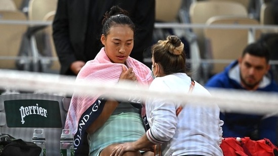 China's Qinwen Zheng receives medical attention during the match(REUTERS)