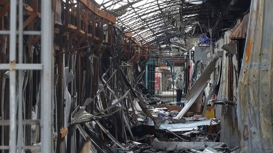 A local resident stands next to debris of an open market destroyed by a military strike, as Russia's attack on Ukraine continues, in Sievierodonetsk, Luhansk region. (File image)