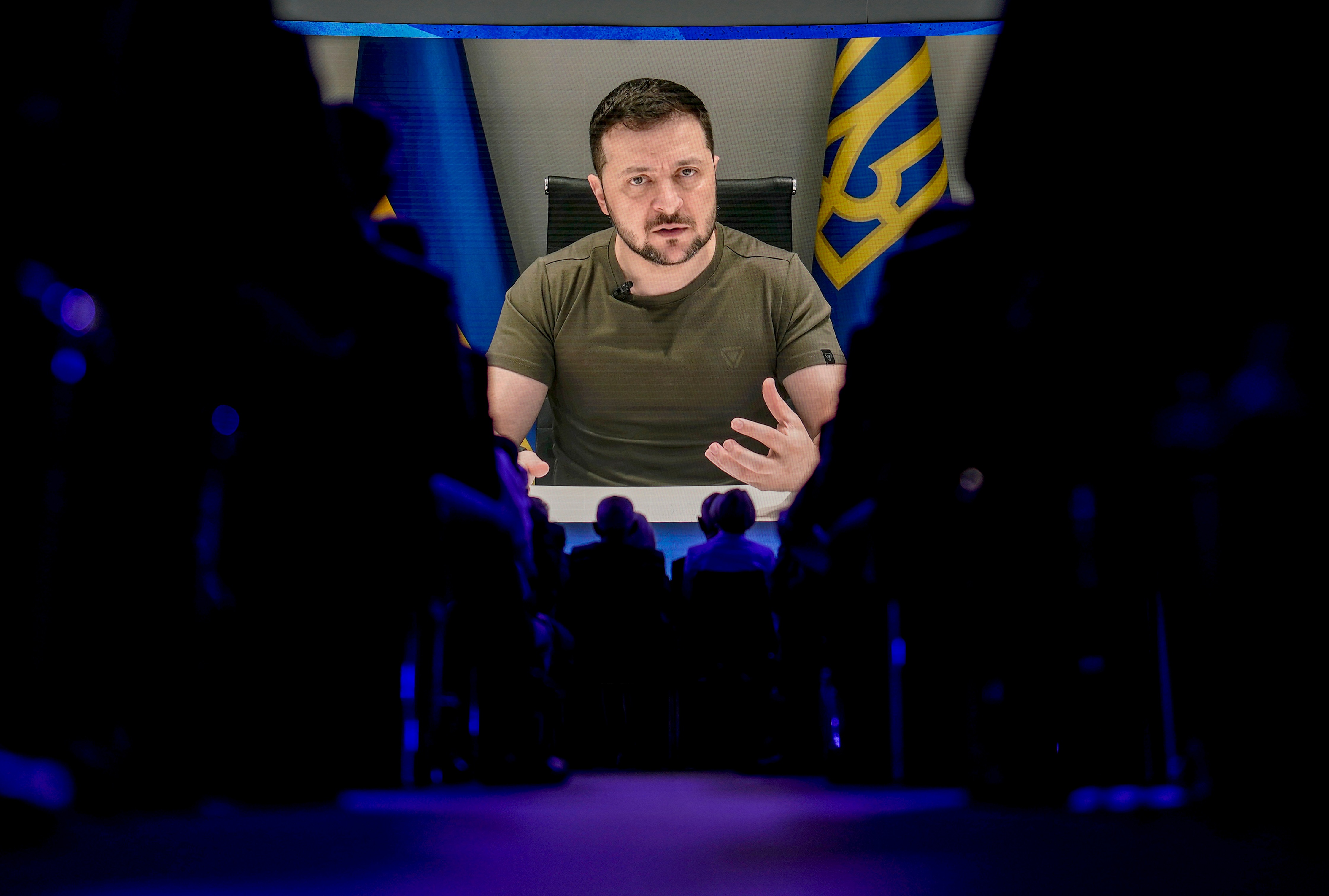 FILE - Ukrainian President Volodymyr Zelensky is seen on a screen addressing the audience from Kyiv during the World Economic Forum in Davos, Switzerland. (AP) FILE - Ukrainian President Volodymyr Zelensky is seen on a screen addressing the audience from Kyiv during the World Economic Forum in Davos, Switzerland. (AP)