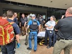 Emergency personnel work at the scene of a shooting at the Warren Clinic in Tulsa, Oklahoma.