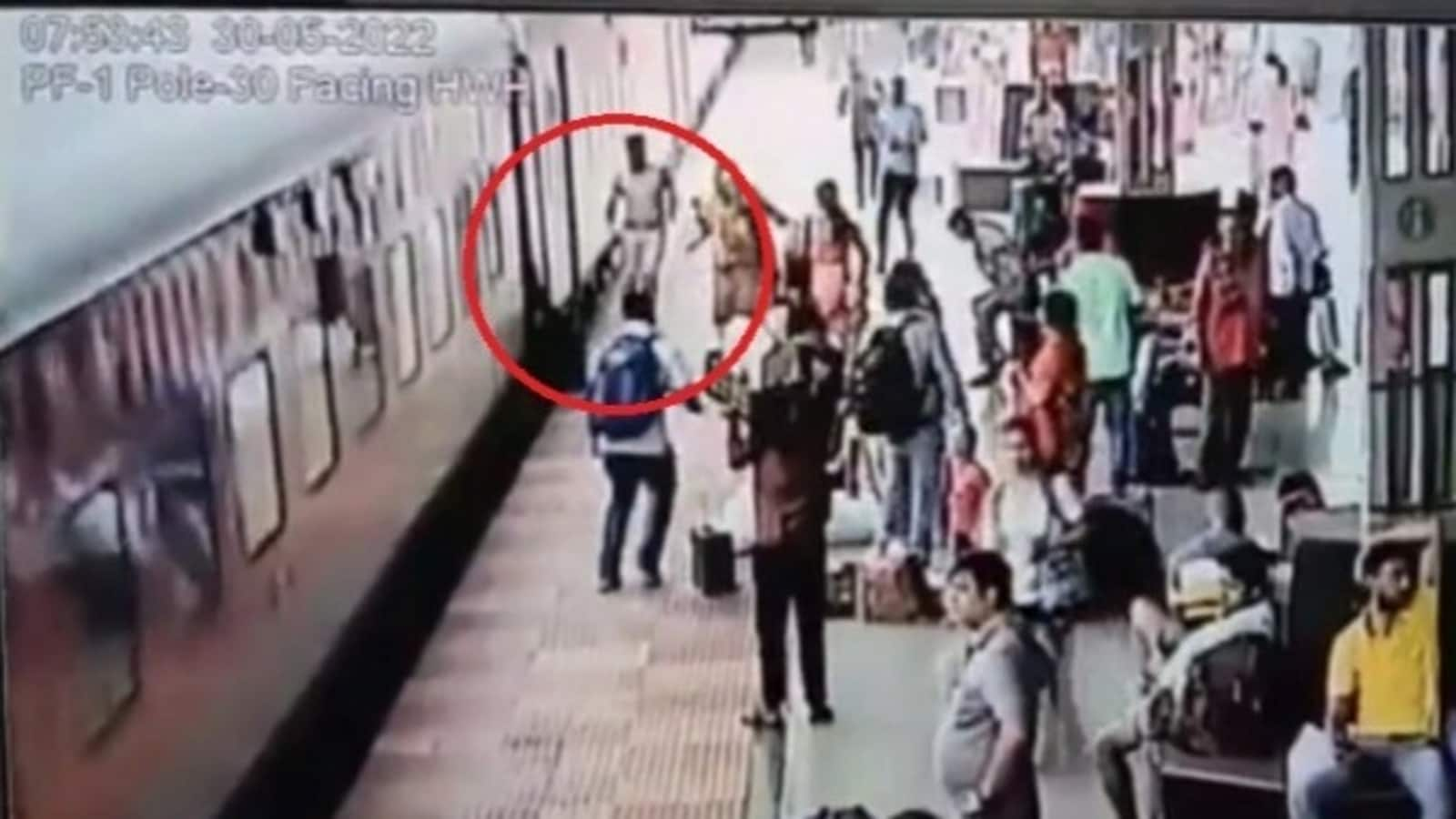 Woman tries boarding a running train, falls. Watch how policeman saves her  | Trending - Hindustan Times