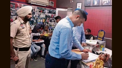 Fire department officials serving an inspection notice at a coaching institute in Tuition Market, Model Town Extension, Ludhiana, on Wednesday. (HT Photo) Fire department officials serving an inspection notice at a coaching institute in Tuition Market, Model Town Extension, Ludhiana, on Wednesday. (HT Photo)