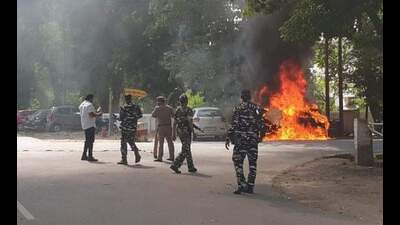 The two cars on fire near Allahabad high court on Tuesday. (HT PHOTO)