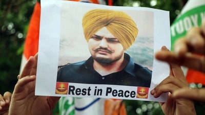 A Jammu and Kashmir Youth Congress supporter holding a placard stage a protest against the Punjab government over the recent killing of Punjabi singer and Congress leader Sidhu Moose Wala in the Mansa district.&nbsp; (ANI)