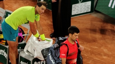 Serbia's Novak Djokovic walks off dejected after losing his quarter final match against Spain's Rafael Nadal (REUTERS)
