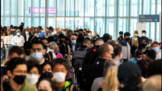 Travellers crowd the security queue in the departures lounge at the start of the Victoria Day holiday long weekend at Toronto Pearson International Airport in Mississauga, Ontario, Canada. (REUTERS)