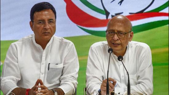 Congress leaders Randeep Surjewala (left) and Abhishek Manu Singhvi addressing a press conference at the party headquarters in New Delhi on Wednesday. (PTI Photo)