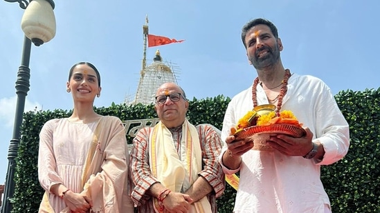 Bollywood actor Akshay Kumar, actress Manushi Chillar and director Chandraprakash Dwivedi pose for a picture during their visit to the Somnath Temple to offer prayers, in Gir Somnath district of Gujarat.(ANI)