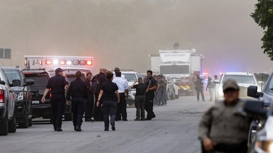 Law enforcement work the scene after a mass shooting at Robb Elementary School where 18 children were killed in Uvalde, Texas.(AFP)