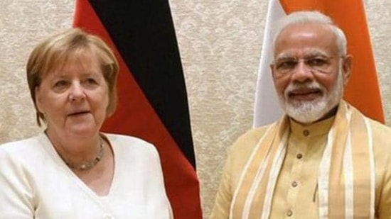 Former German chancellor Angela Merkel and Prime Minister Narendra Modi.&nbsp;(PTI file photo)