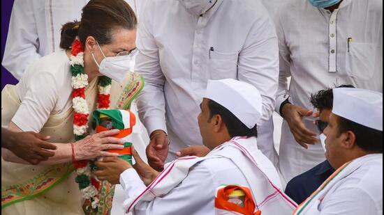 Interim Congress president Sonia Gandhi accepts sand and water from various states from 'padayatris' at the concluding ceremony of the party's Azadi Gaurav Yatra, at Rajghat in New Delhi on Wednesday. (PTI Photo)