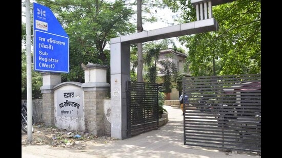 The revenue officials are protesting against the suspension of a naib tehsildar and two sub-registrars in the state for allegedly allowing registry of plots without NOCs. (Harvinder Singh/HT)