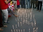 Kashmiri pandits light candles during a protest against the killing of a Kashmiri Pandit Rahul Bhat on May 19.