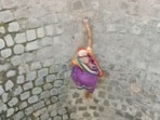 In the video, woman can be seen climbing up the sheer wall of the well. In the video, woman can be seen climbing up the sheer wall of the well.